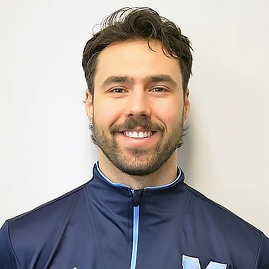 A man in blue top against a white background